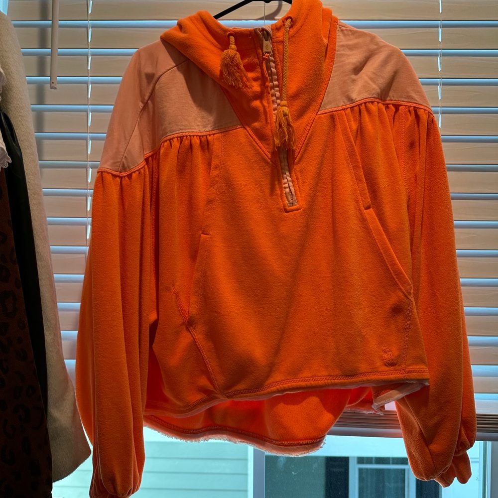 Not sold anymore- bright orange free people quarter zip!